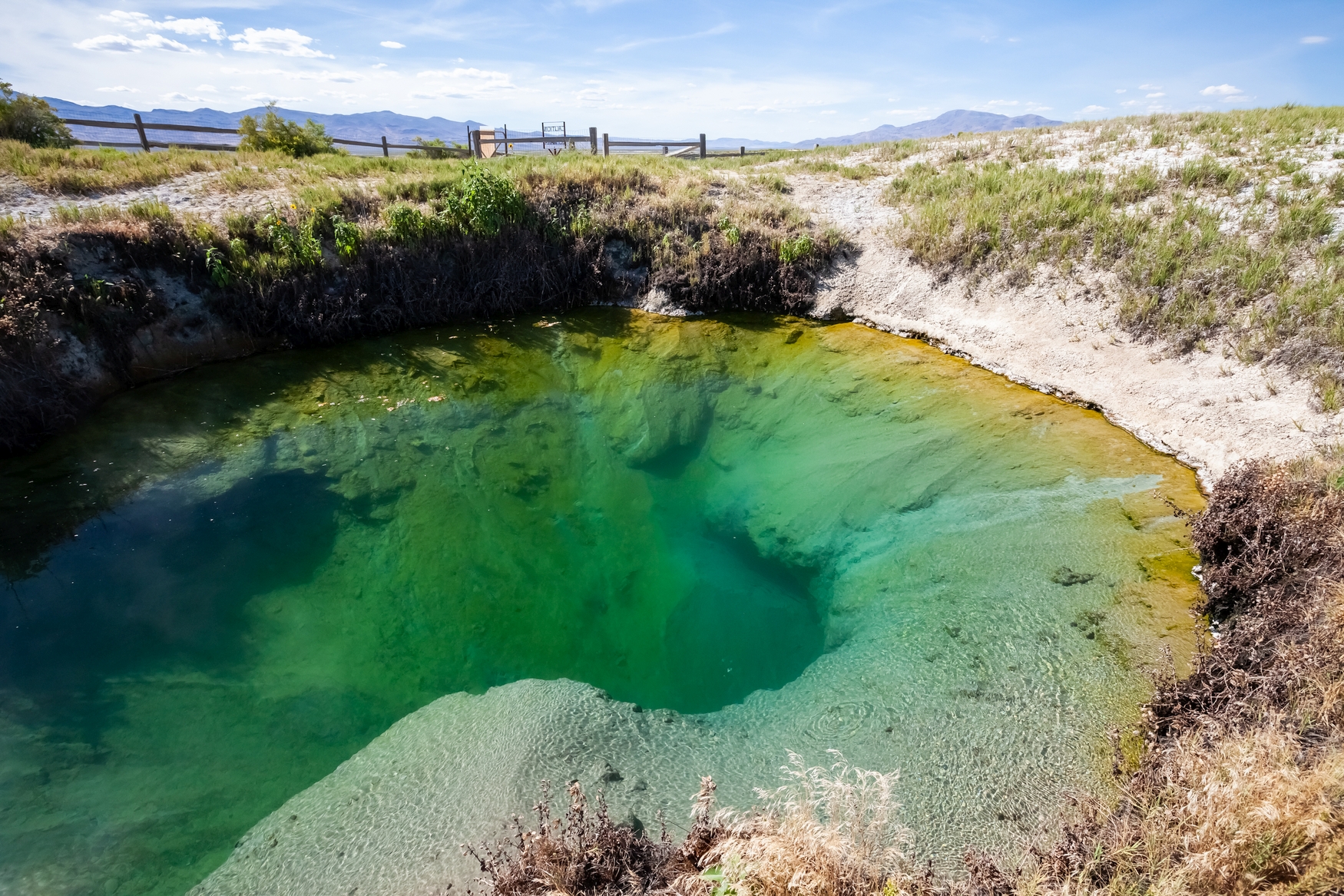 Photo of a deep hot spring pool in the Black Rock Desert, Nevada.