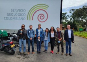 Group standing in front of Servicio Geologico Colombiano sign in Bogota.